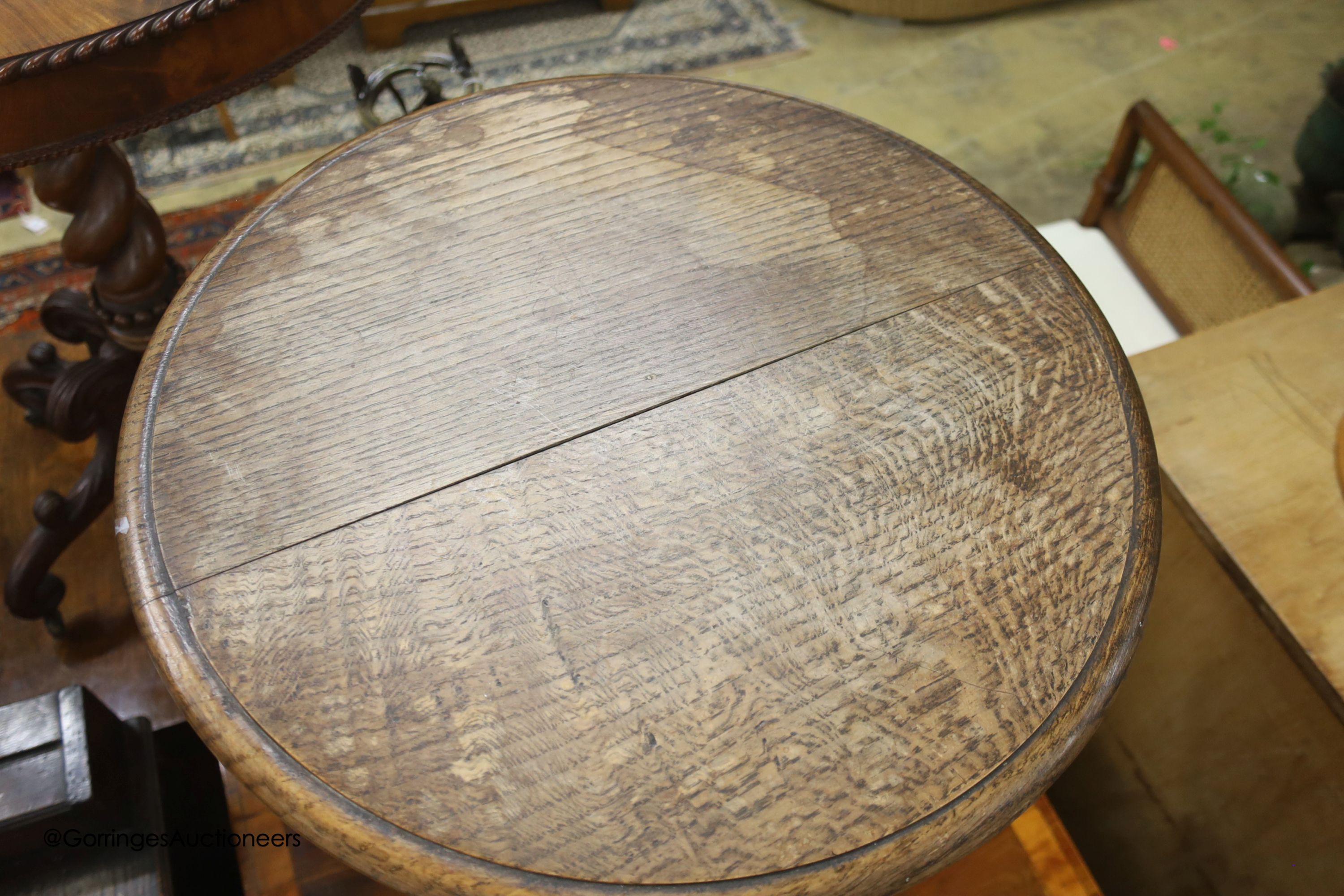 A carved oak and hardwood circular occasional table, diameter 50cm, height 74cm